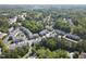 Expansive aerial view of a residential community nestled among lush green trees and winding streets at 1029 Frank Page Dr, Cary, NC 27519