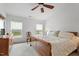 Bright bedroom with neutral colors, comfortable bed, fan, and natural light at 1029 Frank Page Dr, Cary, NC 27519