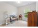 Relaxing bedroom with a comfortable bench, vintage furniture and sunlit window at 1029 Frank Page Dr, Cary, NC 27519