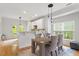 Bright dining area featuring modern decor, natural light, and access to the outdoor living space at 1029 Frank Page Dr, Cary, NC 27519