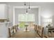 Bright dining room featuring tufted chairs and modern pendant lighting at 1029 Frank Page Dr, Cary, NC 27519
