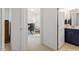 Hallway view of a home office, with a bathroom and closet located nearby at 1029 Frank Page Dr, Cary, NC 27519