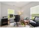Bright home office with two windows, a comfortable desk, and ample workspace at 1029 Frank Page Dr, Cary, NC 27519