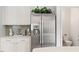 Kitchen features stainless steel fridge and stone countertops at 1029 Frank Page Dr, Cary, NC 27519