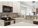 Kitchen with subway tile backsplash and white cabinets at 1029 Frank Page Dr, Cary, NC 27519