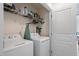 Convenient laundry area with washer, dryer, shelving and storage space at 1029 Frank Page Dr, Cary, NC 27519