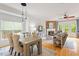 Open living and dining area with modern lighting and hardwood floors at 1029 Frank Page Dr, Cary, NC 27519