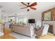 Open-concept living room flows into the kitchen and offers a stone fireplace at 1029 Frank Page Dr, Cary, NC 27519
