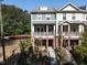 Charming brick townhouse with inviting front porch and beautifully landscaped walkway at 1029 Frank Page Dr, Cary, NC 27519