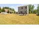 Spacious backyard with a concrete patio, outdoor furniture, and a grill perfect for entertaining at 1036 S Fieldhaven Dr, Fuquay Varina, NC 27526