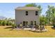 Backyard patio features outdoor seating areas, a grill, and plenty of space for entertaining guests at 1036 S Fieldhaven Dr, Fuquay Varina, NC 27526