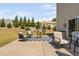 Spacious backyard patio with outdoor seating and well maintained landscaping at 1036 S Fieldhaven Dr, Fuquay Varina, NC 27526
