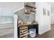 Stylish bar area with floating shelves, decorative touches, and a convenient wine rack at 1036 S Fieldhaven Dr, Fuquay Varina, NC 27526