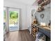 Wet bar with backyard view, floating shelves, wine storage, and stylish decor at 1036 S Fieldhaven Dr, Fuquay Varina, NC 27526