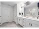 Bright bathroom with double sink vanity, modern fixtures, and stylish gray flooring at 1036 S Fieldhaven Dr, Fuquay Varina, NC 27526