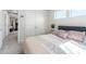 Well lit bedroom with large windows, neutral walls, and a closet at 1036 S Fieldhaven Dr, Fuquay Varina, NC 27526