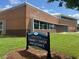 Exterior view of a community center with a brick facade and large windows for community activities at 1036 S Fieldhaven Dr, Fuquay Varina, NC 27526