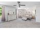 Bright and airy main bedroom with a comfortable bed, dresser, and soft carpeting at 1036 S Fieldhaven Dr, Fuquay Varina, NC 27526