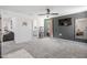 Spacious main bedroom featuring a bed, neutral decor, and gray accent wall at 1036 S Fieldhaven Dr, Fuquay Varina, NC 27526