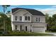Charming two-story home featuring a covered front porch, well-maintained lawn, and classic architectural details at 104 Sodalite Ln, Holly Springs, NC 27540