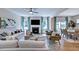 Inviting living room with fireplace, open floor plan, stylish furniture, and a dining area at 104 Sodalite Ln, Holly Springs, NC 27540