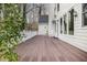 An inviting back deck with rocking chairs offers outdoor relaxation and backyard views at 108 Monarch Way, Cary, NC 27518