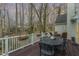 Outdoor deck area perfect for relaxation with table, chairs, and natural surroundings at 108 Monarch Way, Cary, NC 27518