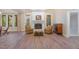Basement with a brick fireplace, mantel, and hardwood floors at 108 Monarch Way, Cary, NC 27518