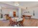 Spacious basement featuring a pool table, round table with chairs, and hardwood floors at 108 Monarch Way, Cary, NC 27518