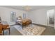 Cozy bedroom featuring a ceiling fan, two windows and a decorative rug at 108 Monarch Way, Cary, NC 27518