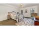 Comfortable bedroom with carpet, ceiling fan, and natural light from two windows; cozy and inviting at 108 Monarch Way, Cary, NC 27518