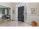 Inviting entryway with a black front door, sidelights, and tiled floor at 108 Monarch Way, Cary, NC 27518