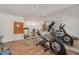 Bright gym with exercise machines, free weights, and mirrored wall at 108 Monarch Way, Cary, NC 27518