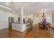 Spacious kitchen with hardwood floors, a central island, and stainless steel appliances at 108 Monarch Way, Cary, NC 27518