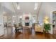 Bright living room with skylights, fireplace, and large windows with views of the backyard at 108 Monarch Way, Cary, NC 27518