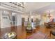 Open living space showcases hardwood floors, a modern kitchen, and staircase to the second floor at 108 Monarch Way, Cary, NC 27518