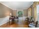 This office offers a quiet workspace, with hardwood floors and natural light from the window at 108 Monarch Way, Cary, NC 27518