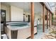 Outdoor patio with a hot tub, ceiling fan, and view of the backyard at 108 Monarch Way, Cary, NC 27518