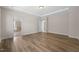 Bedroom featuring a hardwood floor, a window, recessed lighting, and view into on-suite bathroom at 1120 Copper Beech Ln, Wake Forest, NC 27587