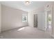 Bedroom featuring a neutral carpet, a window, and door to another room at 1120 Copper Beech Ln, Wake Forest, NC 27587