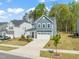 Charming two-story home with a manicured lawn and attached garage in a Gathering-friendly neighborhood at 1120 Copper Beech Ln, Wake Forest, NC 27587