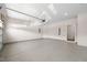 Spacious garage featuring epoxy floors, bright lighting and a side door to the home at 1120 Copper Beech Ln, Wake Forest, NC 27587