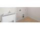 Bright laundry room with a utility sink, hookups, and tiled floor at 1120 Copper Beech Ln, Wake Forest, NC 27587