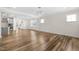 Open concept living area with hardwood floors, recessed lighting and lots of natural light at 1120 Copper Beech Ln, Wake Forest, NC 27587