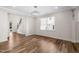 Bright living room boasting hardwood floors, ample natural light, and contemporary decor at 1120 Copper Beech Ln, Wake Forest, NC 27587