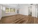 Sunlit living room with hardwood floors, large windows and walk out to the backyard at 1120 Copper Beech Ln, Wake Forest, NC 27587