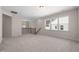 Bright loft with neutral carpet, recessed lighting and stairway access to additional floors and large bright windows at 1120 Copper Beech Ln, Wake Forest, NC 27587