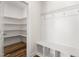 Mudroom with built-in bench and storage cubbies and pantry at 1120 Copper Beech Ln, Wake Forest, NC 27587