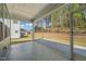 Beautiful screened porch with a view of the backyard and trees at 1120 Copper Beech Ln, Wake Forest, NC 27587