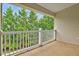 Enjoy views of the surrounding greenery from this covered outdoor balcony at 1123 Claret Ln, Morrisville, NC 27560